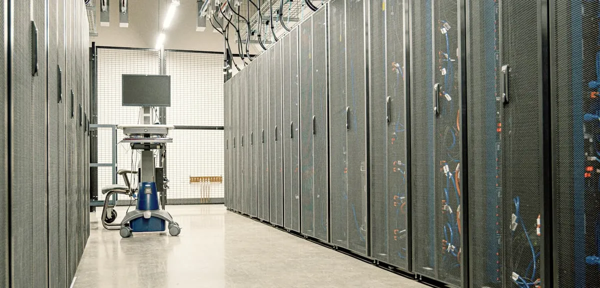 A data center aisle lined with server racks (illustration photo)