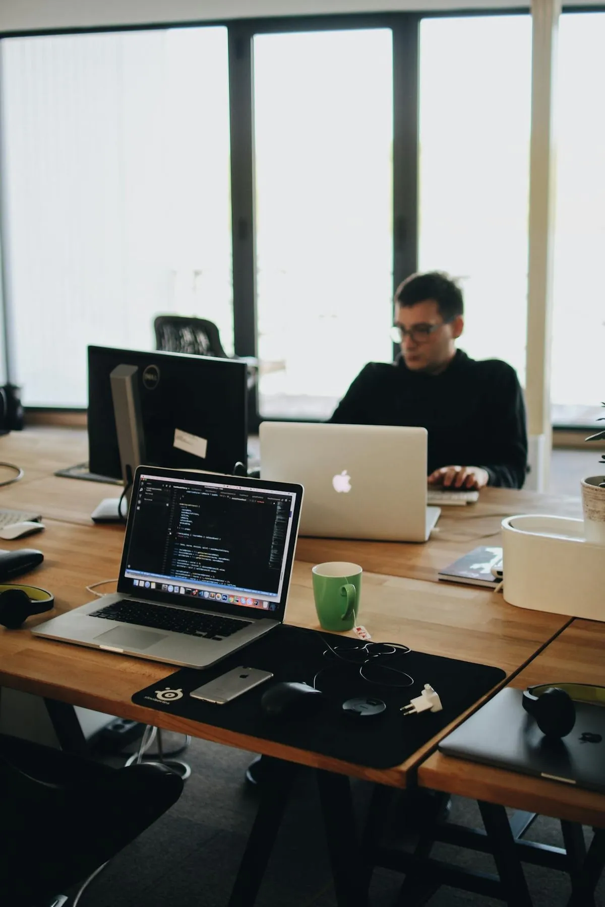 Developers working at their desks in an open-plan office (illustration photo)